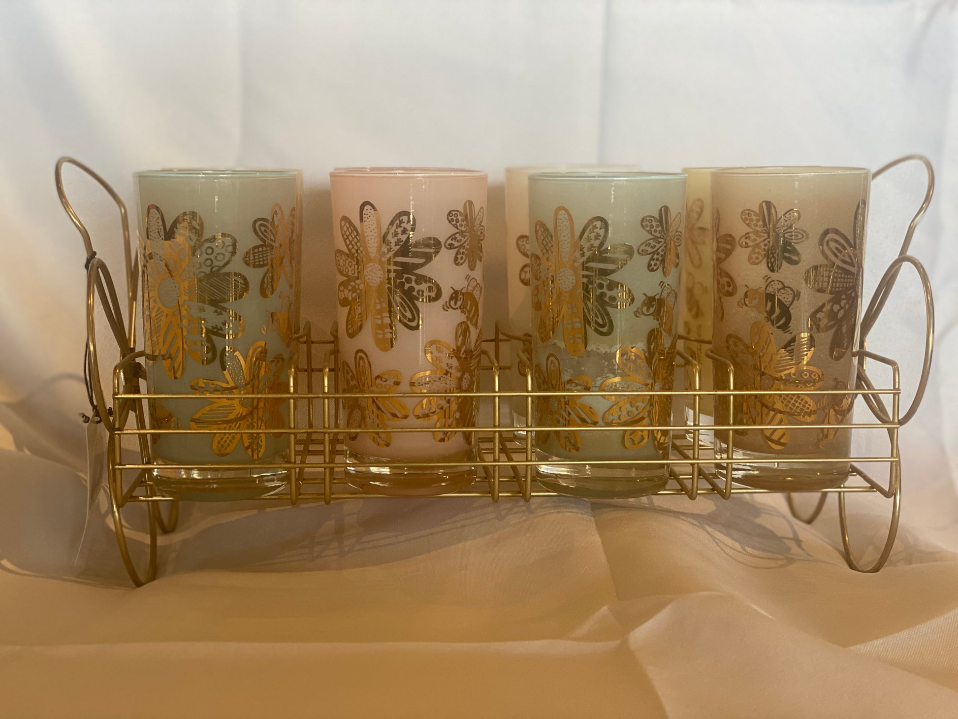 These fabulous Frank Maietta tumblers with flowers and bees in the original caddy are a rare find. The pastels colors are dreamy. One has a tiny chip, but the rest are in perfect shape. They are stunning! Got them on a hunt in Taos, New Mexico!